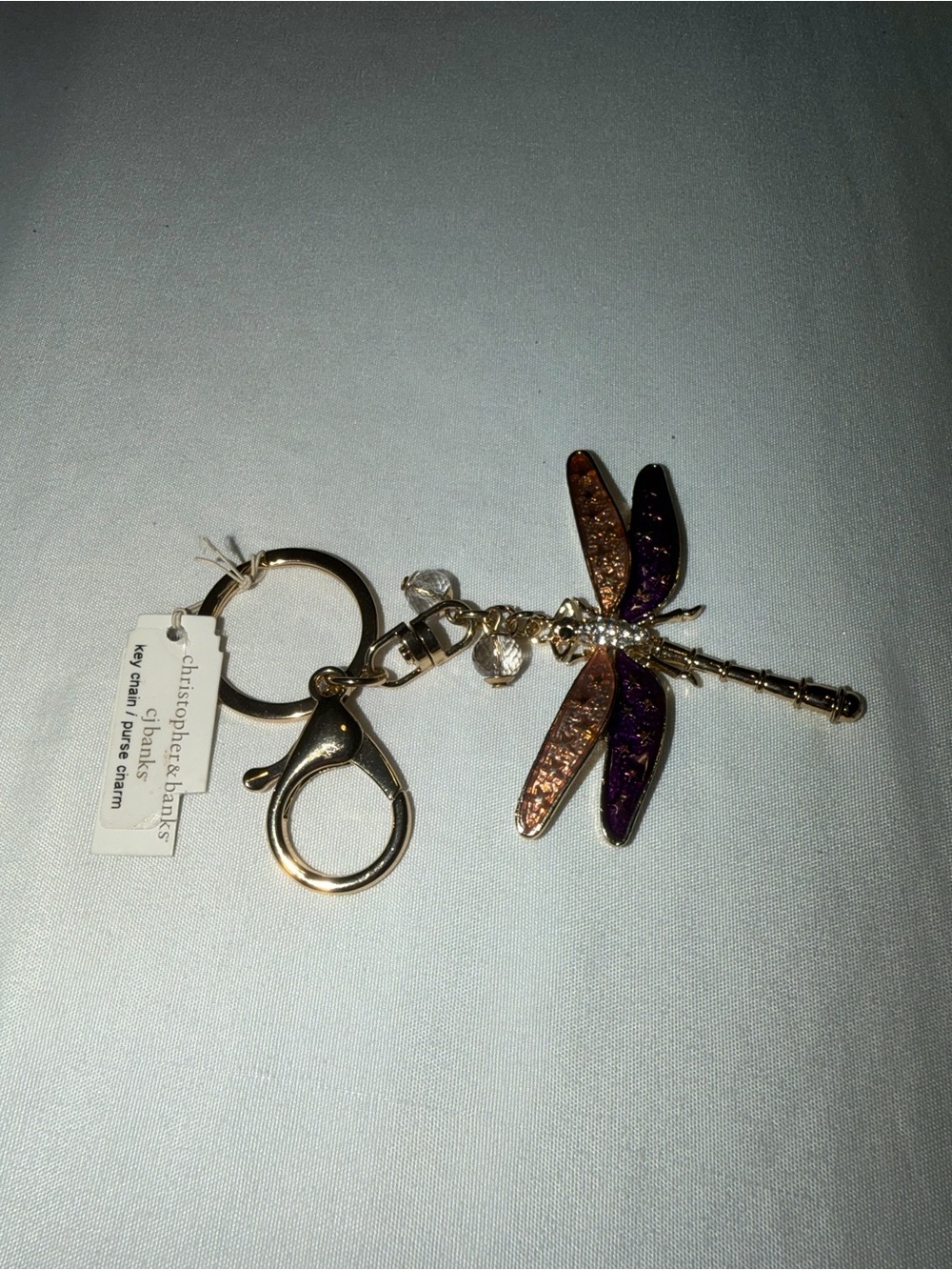 Christopher & Banks Gold Dragonfly Keychain with Purple and Gold Tone Wings